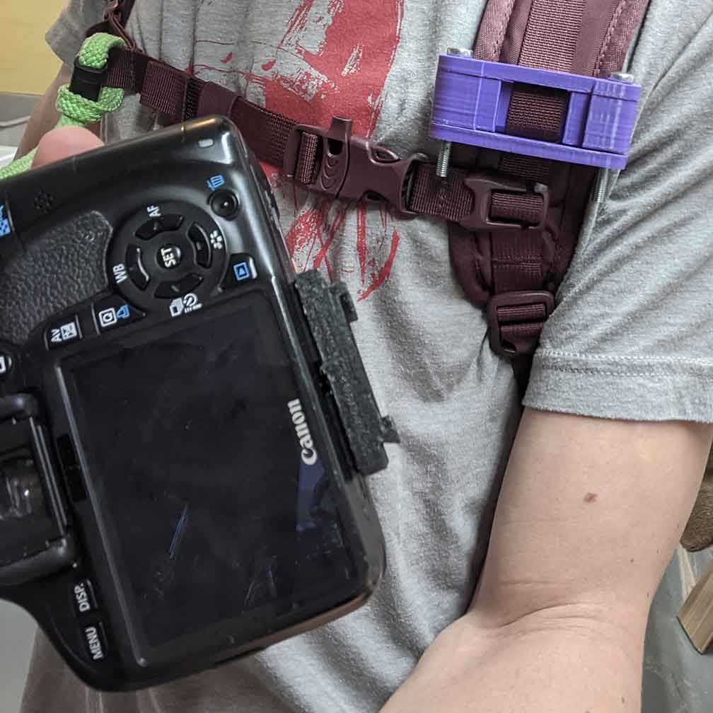 DSLR strap-mount clip attachment